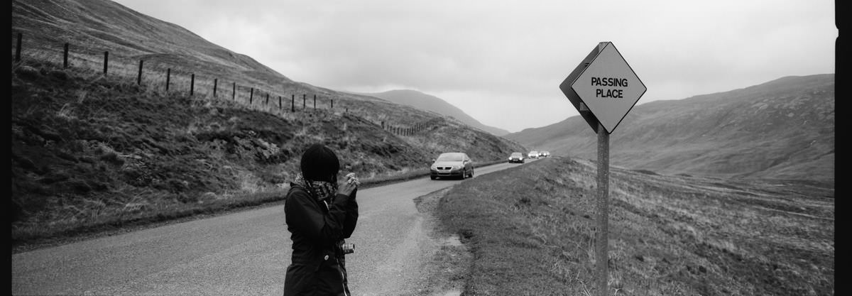 Glen Etive passing place sign in scotland photographing on hasselblad xpan panoramic film camera and kodak trix 400