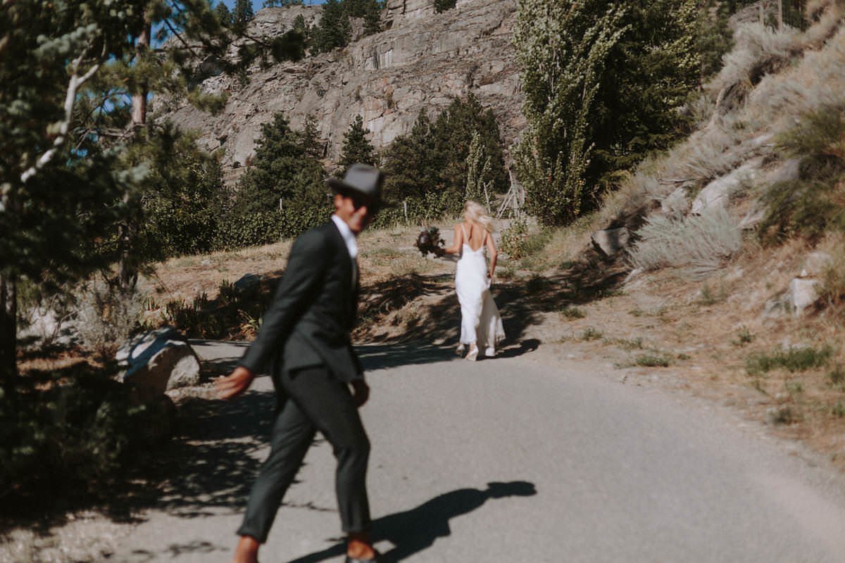 wedding couple posing on a road near god's mountain estate