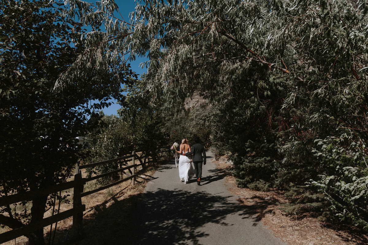 wedding couple posing in an orchard near god's mountain estate