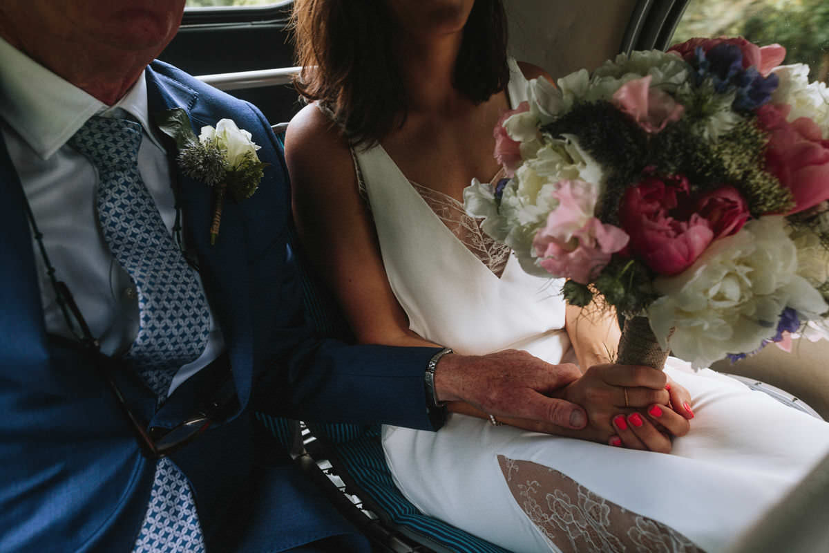 bride and groom inside wedding transportation