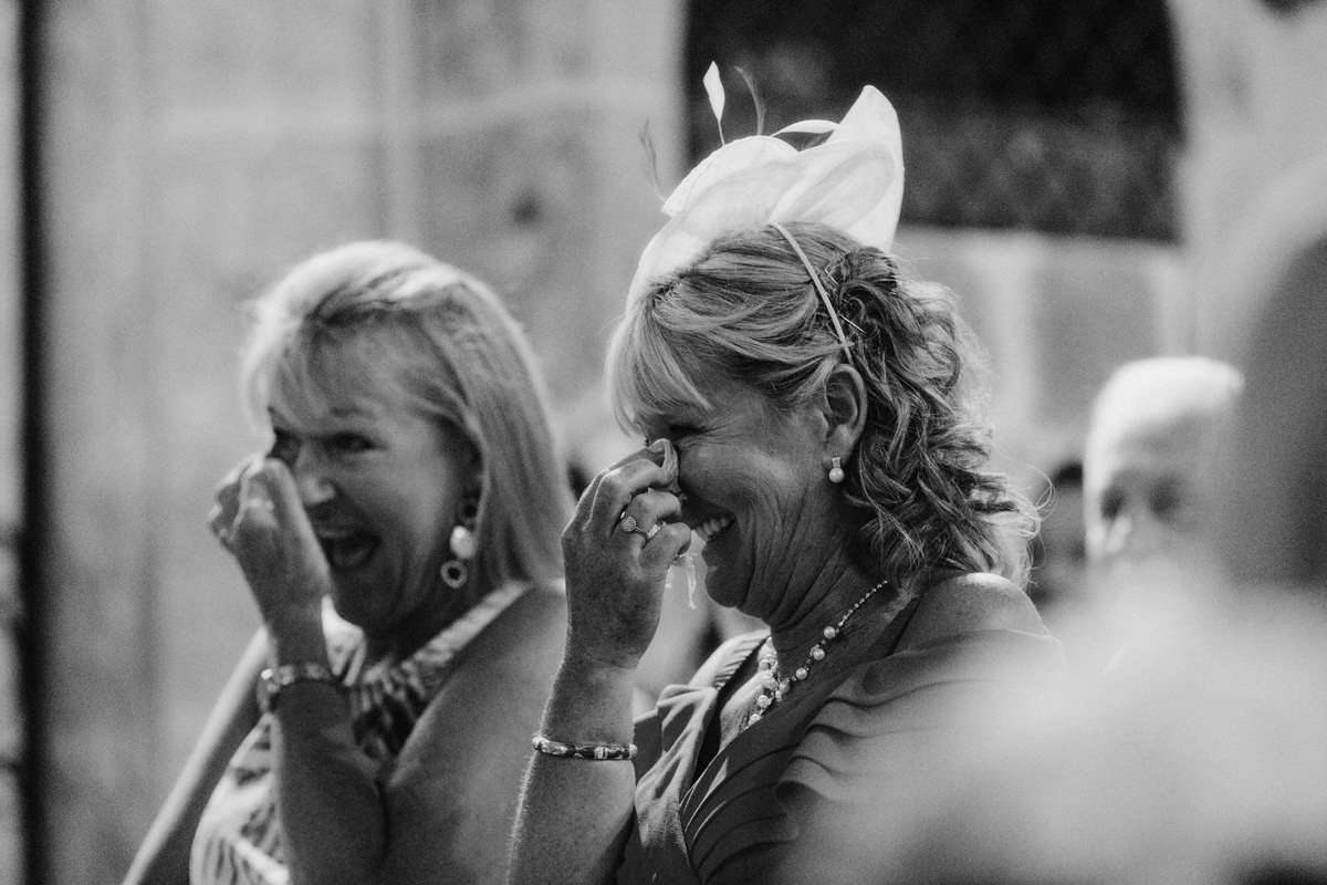 wedding guests at a wedding ceremony inside an old church in the south of france