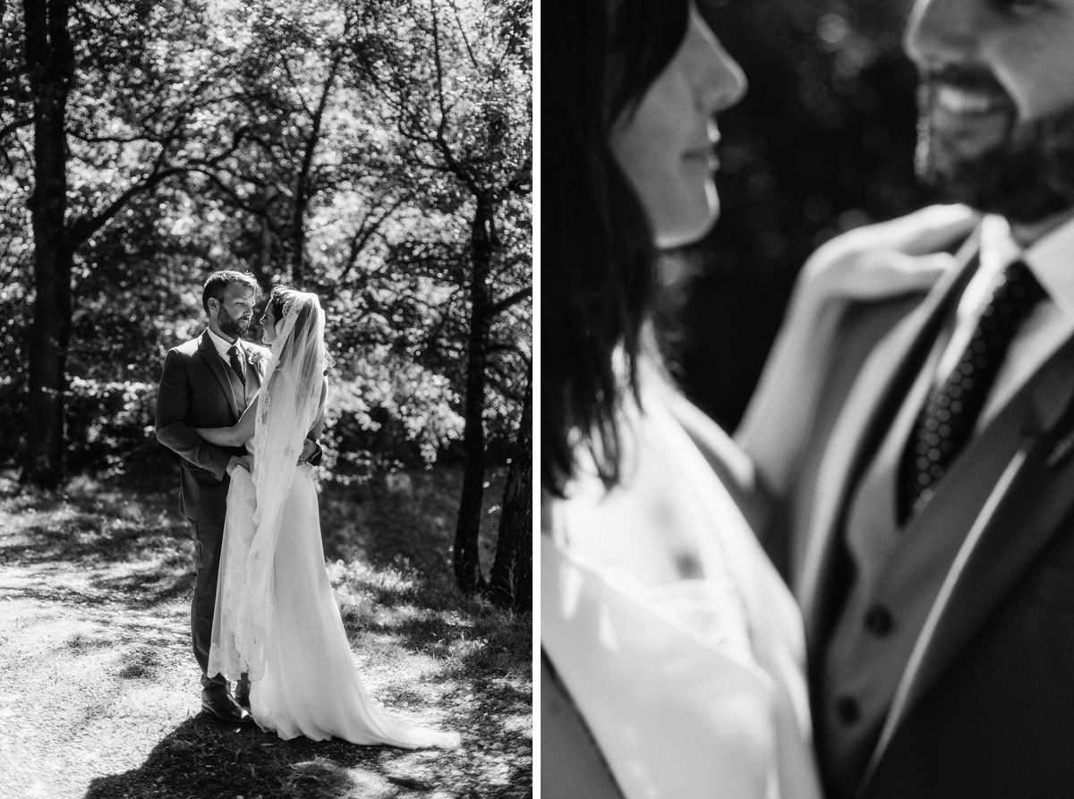 bride and groom posing in a forest on the grounds of chateau de lartigolle