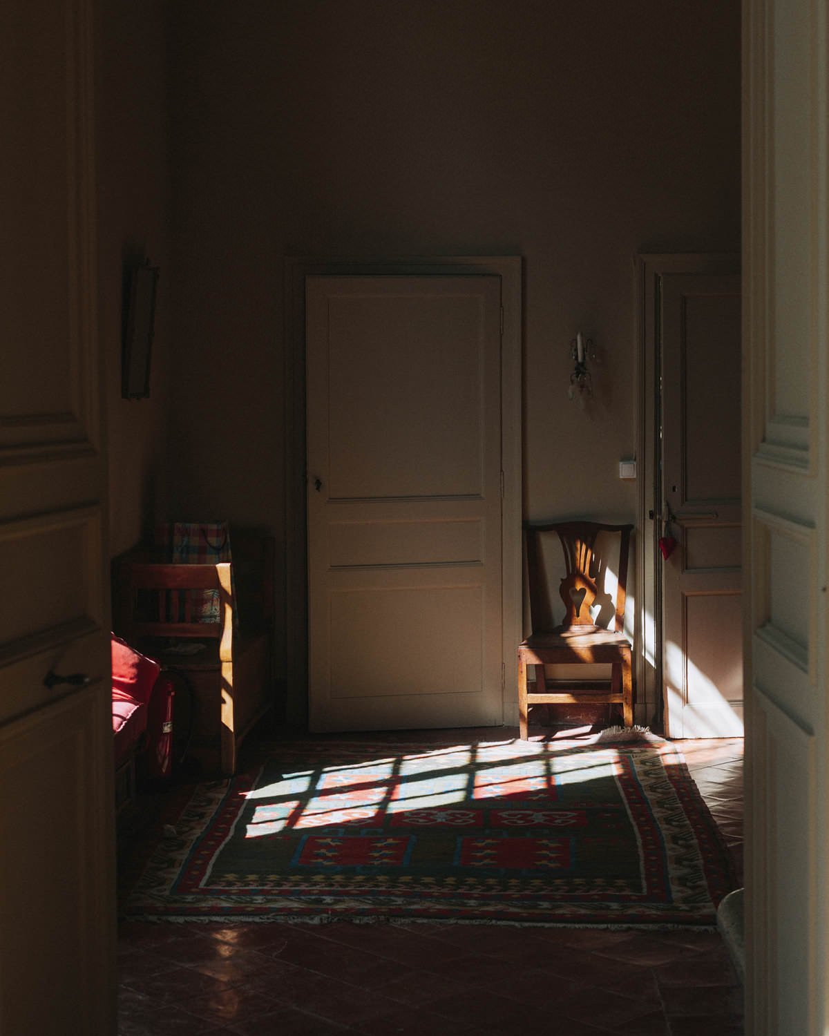 light streaming through a room inside chateau de lartigolle