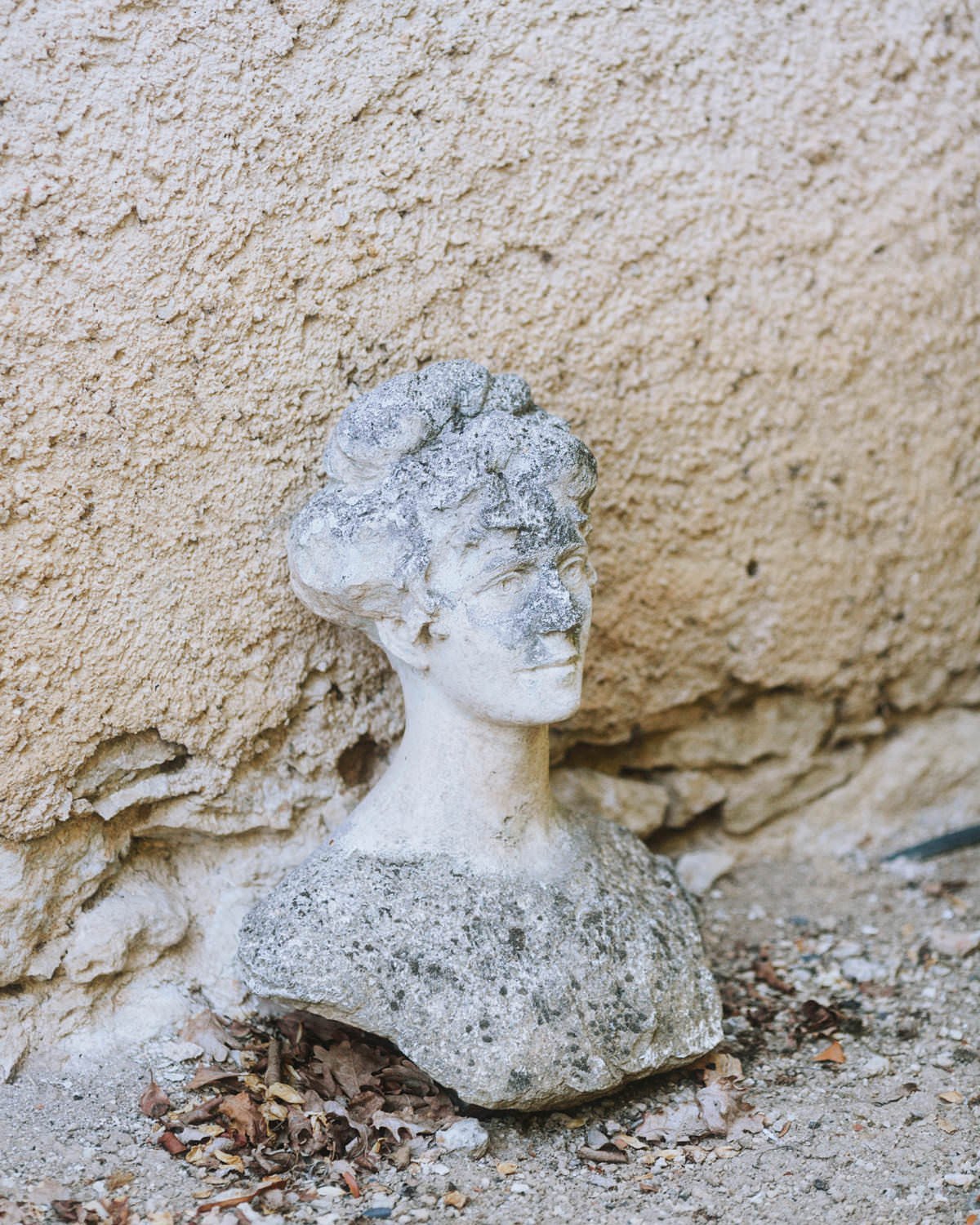 concrete bust at chateau de lartigolle