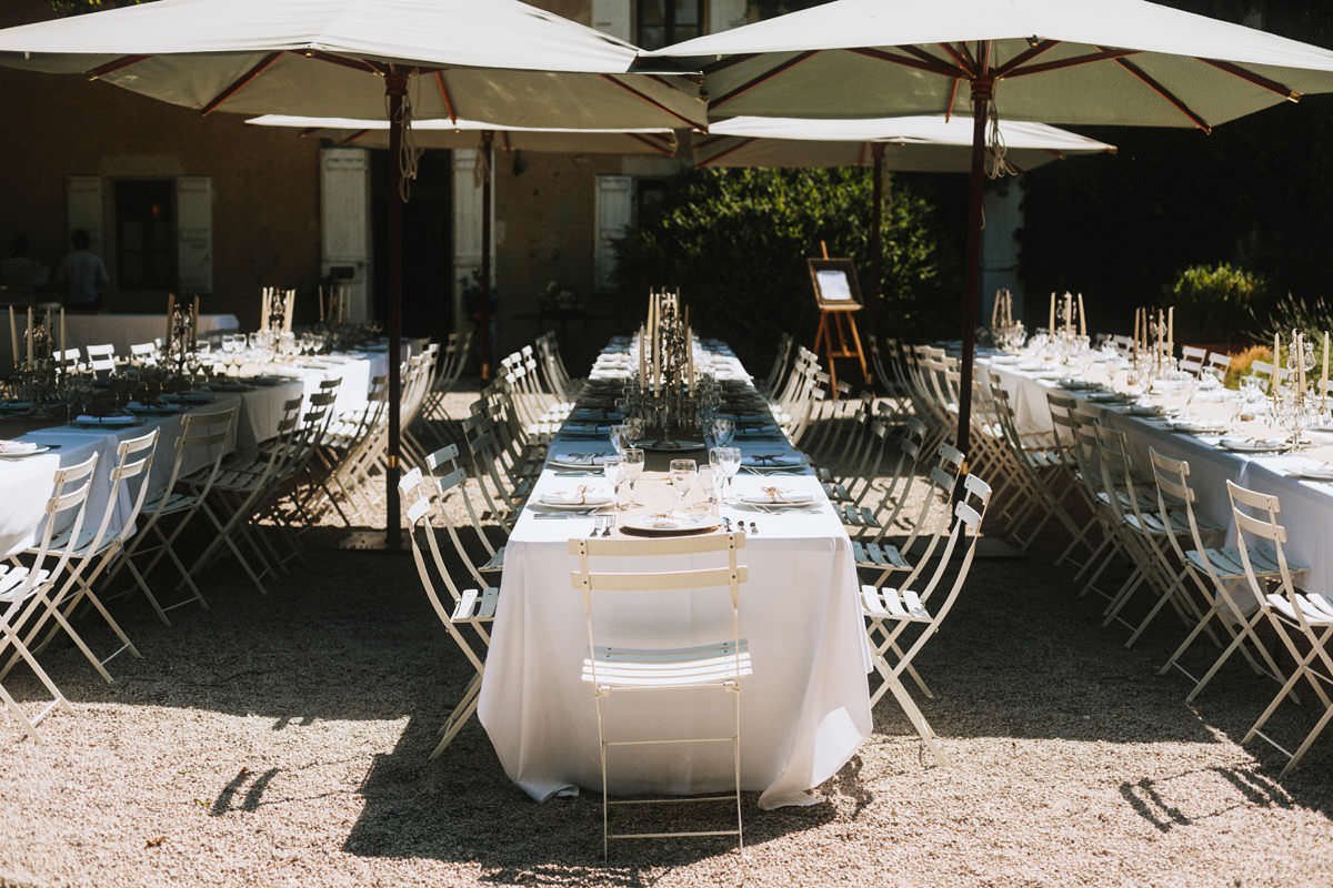 table setting details during a dinner reception at chateau de lartigolle