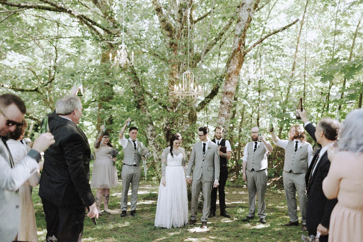 tree chandeliers hanging above wedding ceremony site