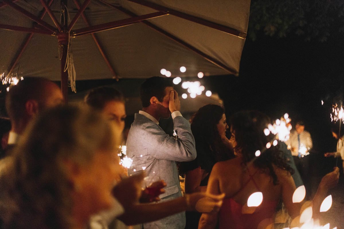 wedding guests holding sparklers