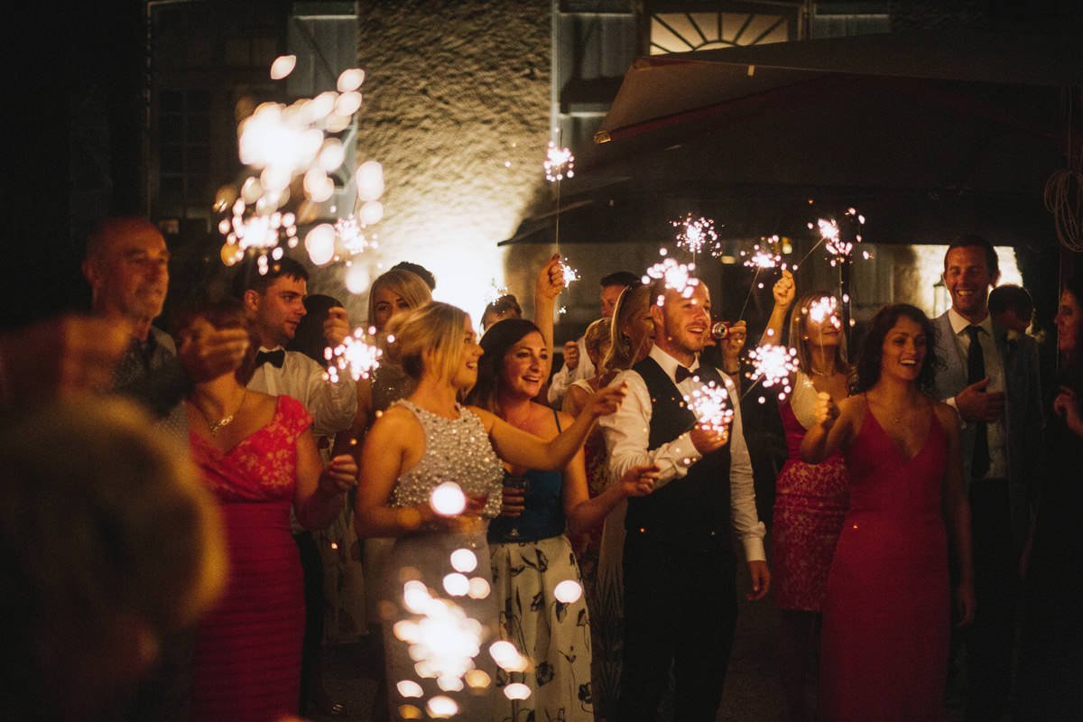 wedding guests holding sparklers