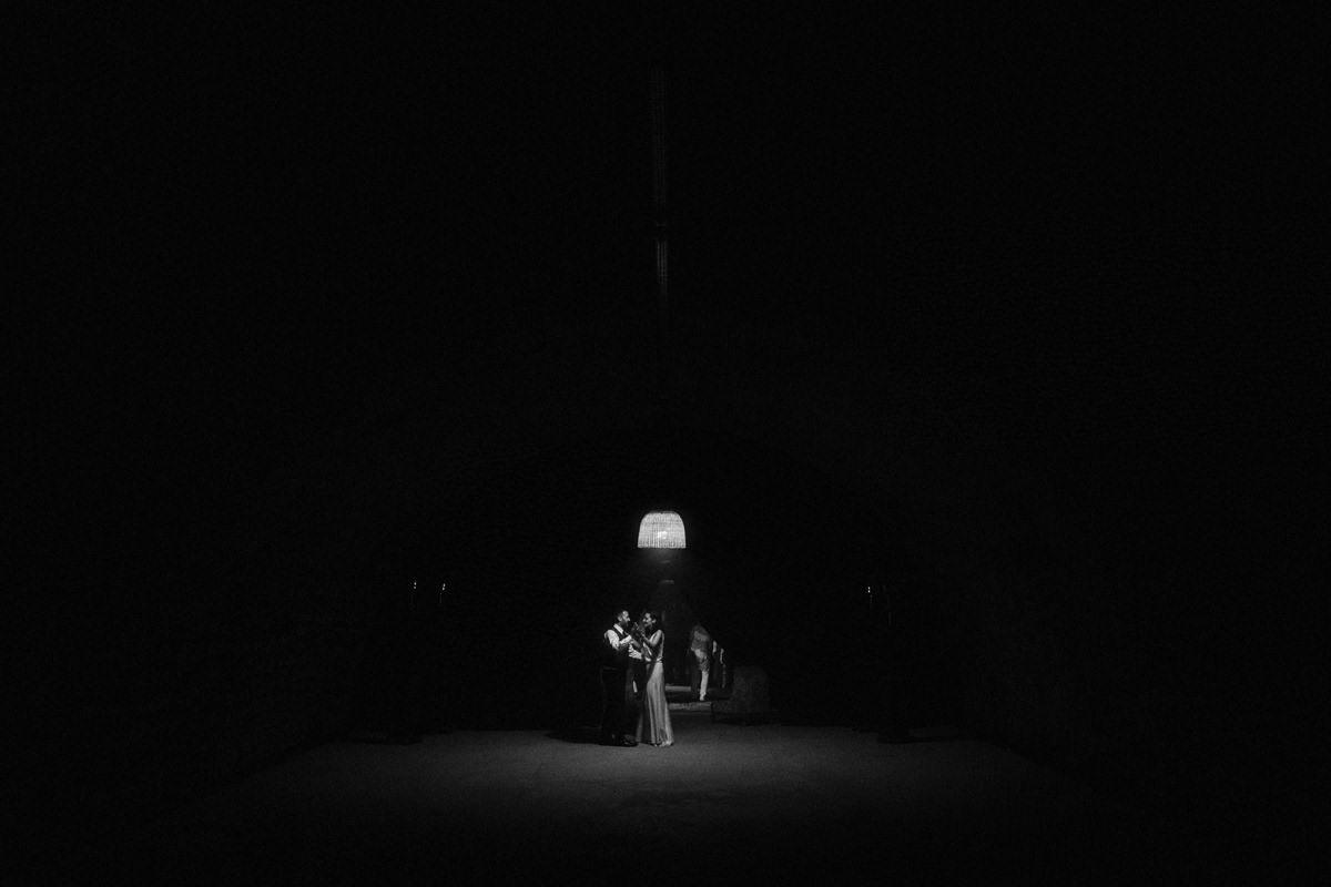 wedding couple dancing under a single light source in france