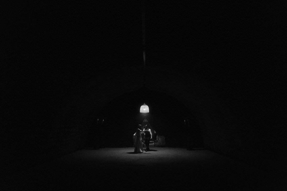 wedding couple dancing under a single light source in france