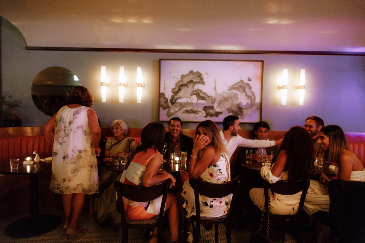 wedding guests dining inside michelin star restaurant kissa tanto