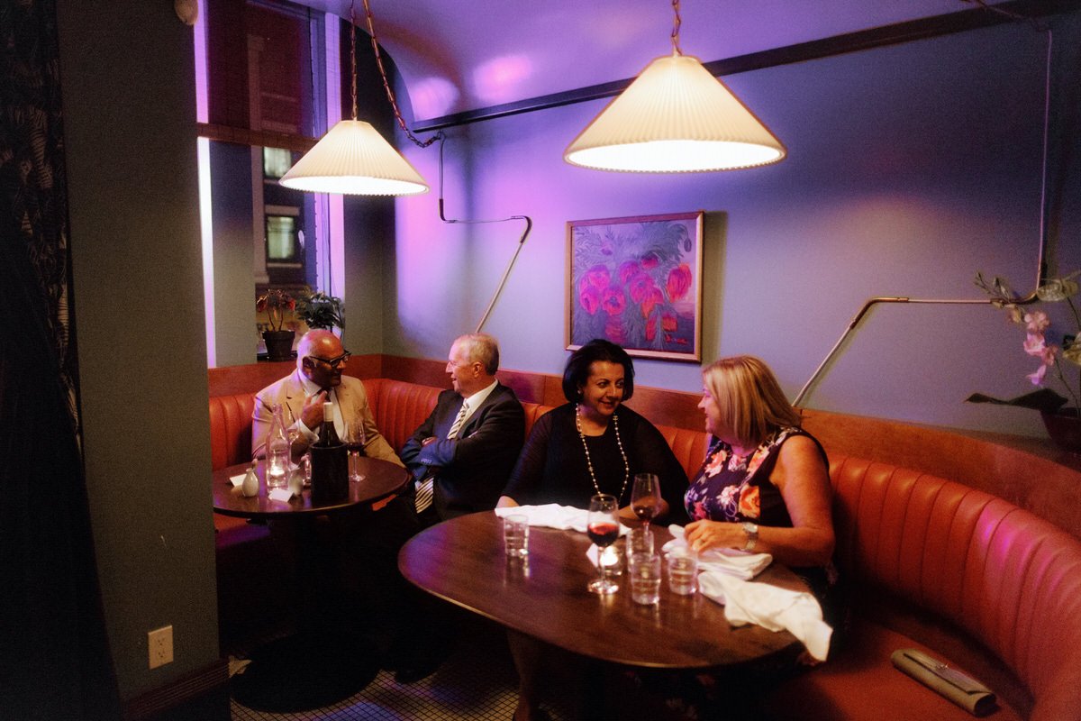 wedding guests dining inside michelin star restaurant kissa tanto