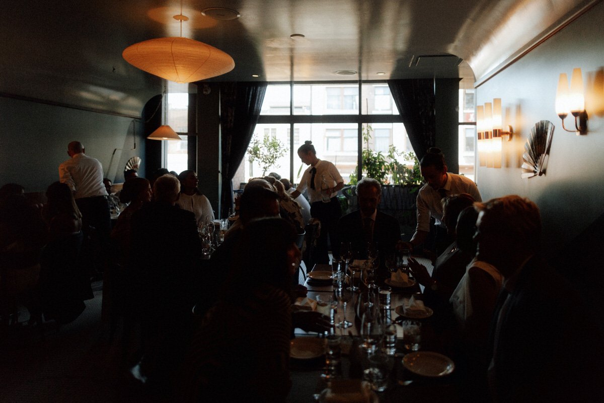 wedding guests dining inside michelin star restaurant kissa tanto