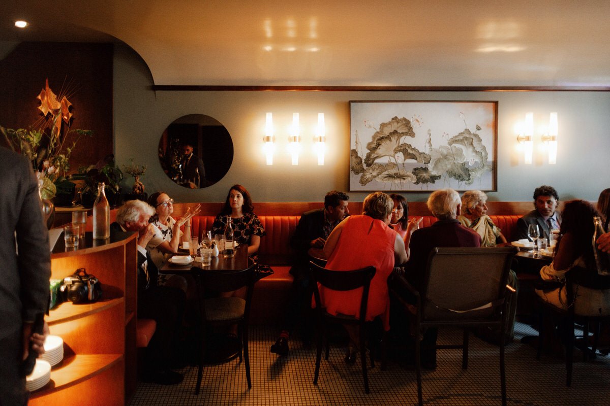 wedding guests dining inside michelin star restaurant kissa tanto