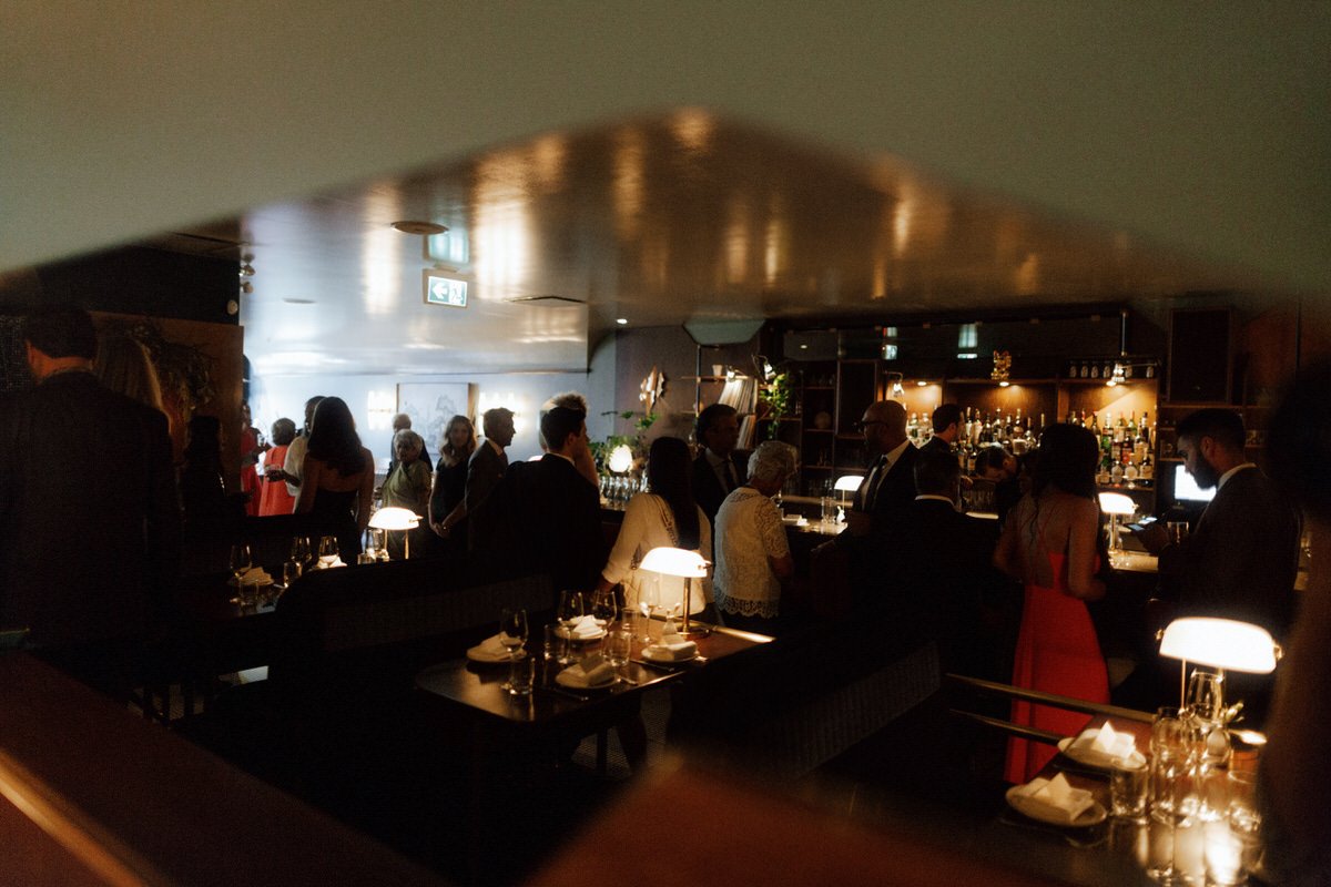 wedding guests dining inside michelin star restaurant kissa tanto