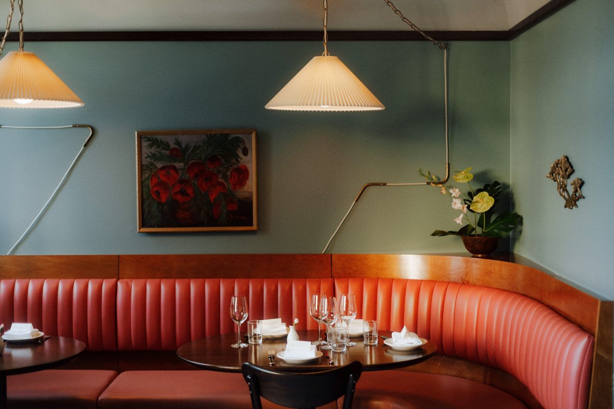 dining booth corner inside kissa tanto restaurant in vancouver