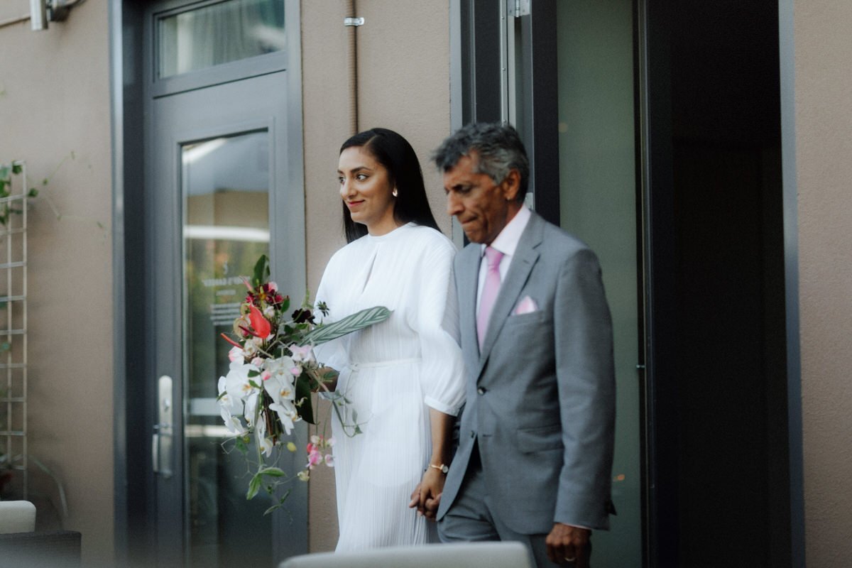 bride and father walking into the wedding ceremony at the vancouver club