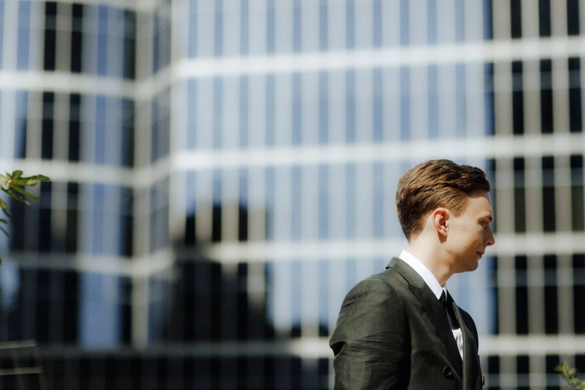 groom during an outdoor wedding ceremony at the vancouver club