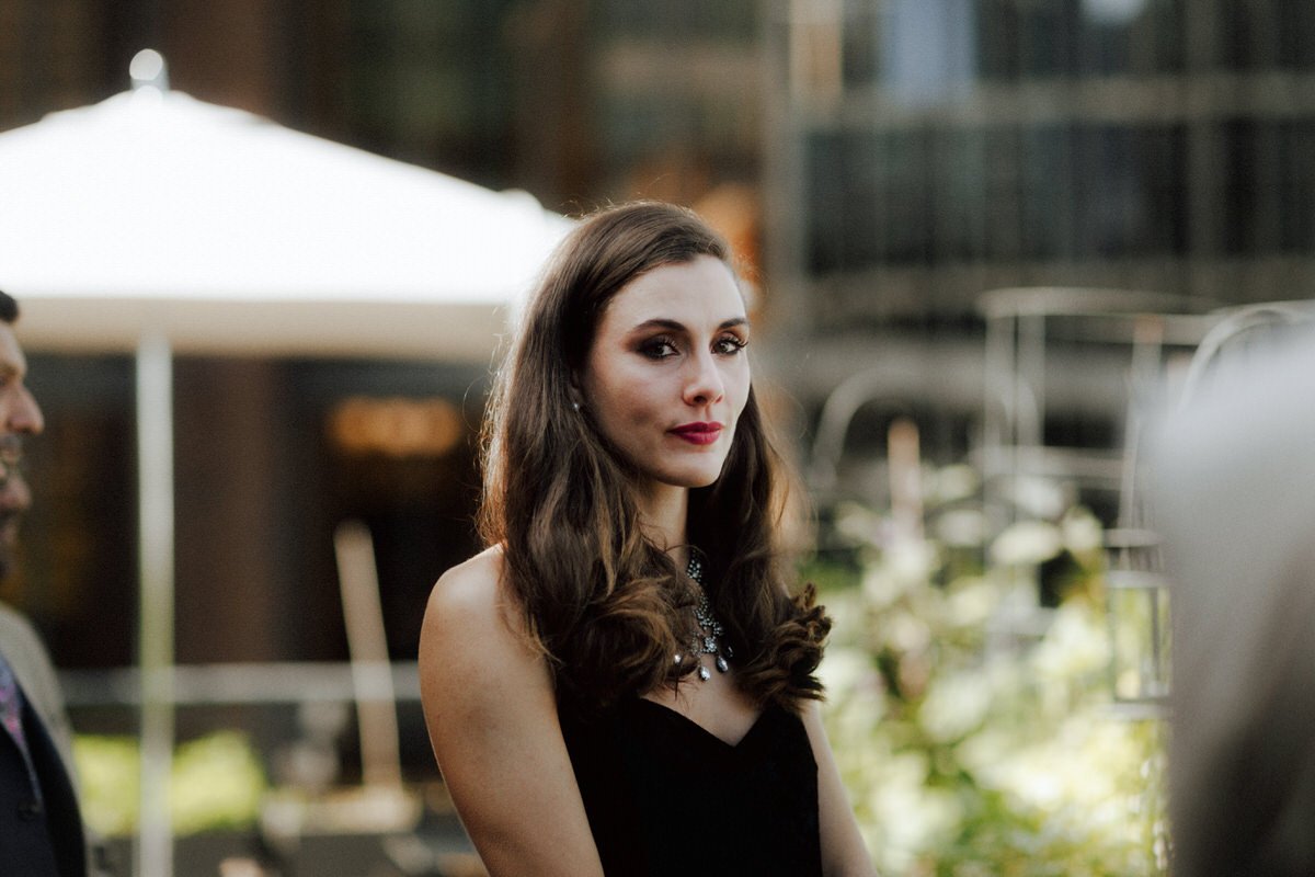 beautiful teary eyed guest during an outdoor ceremony at the vancouver club