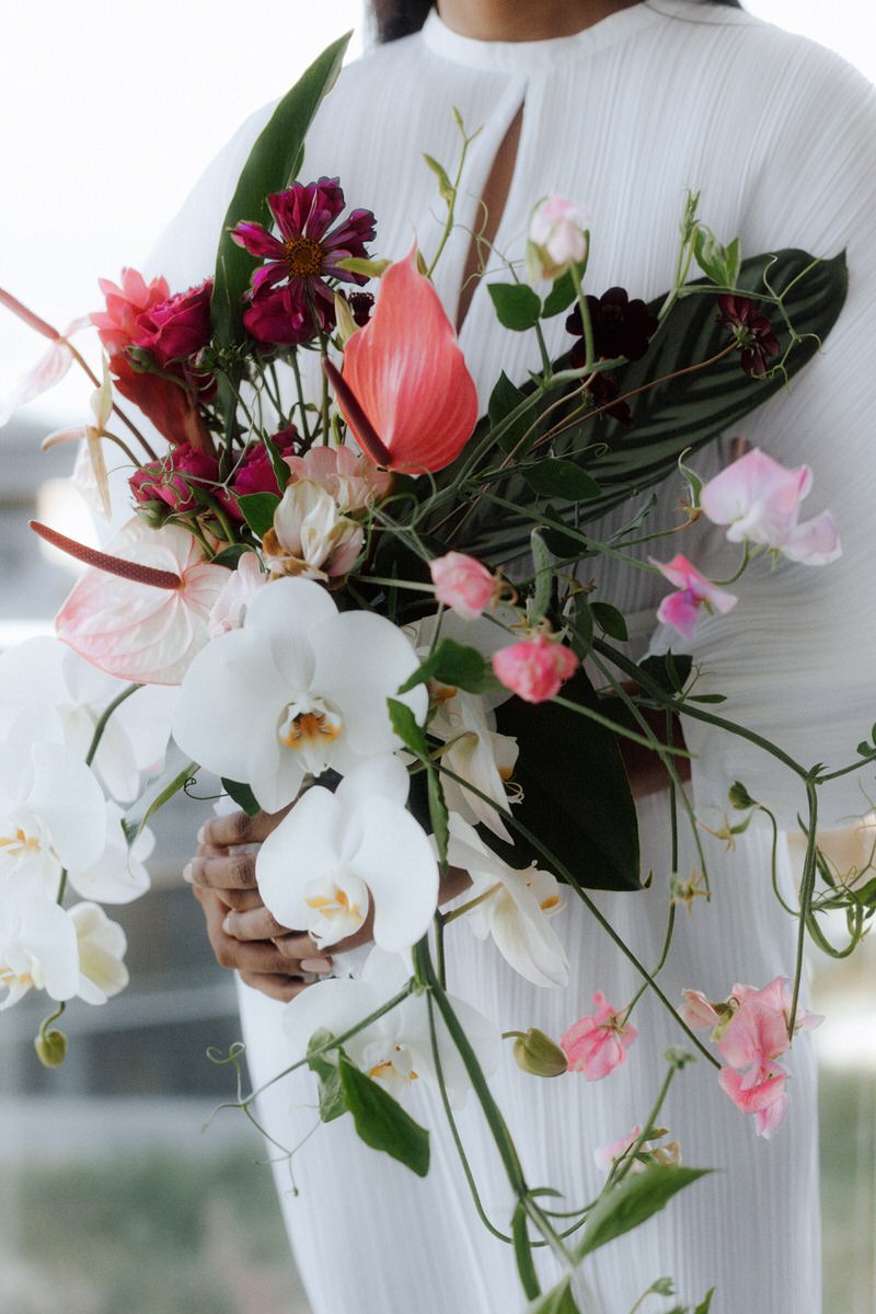 sculptural floral bouquet with orchids and sweet peas