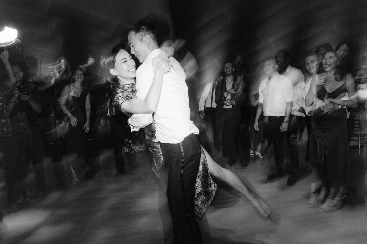 bride and groom having fun on the dance floor in LA