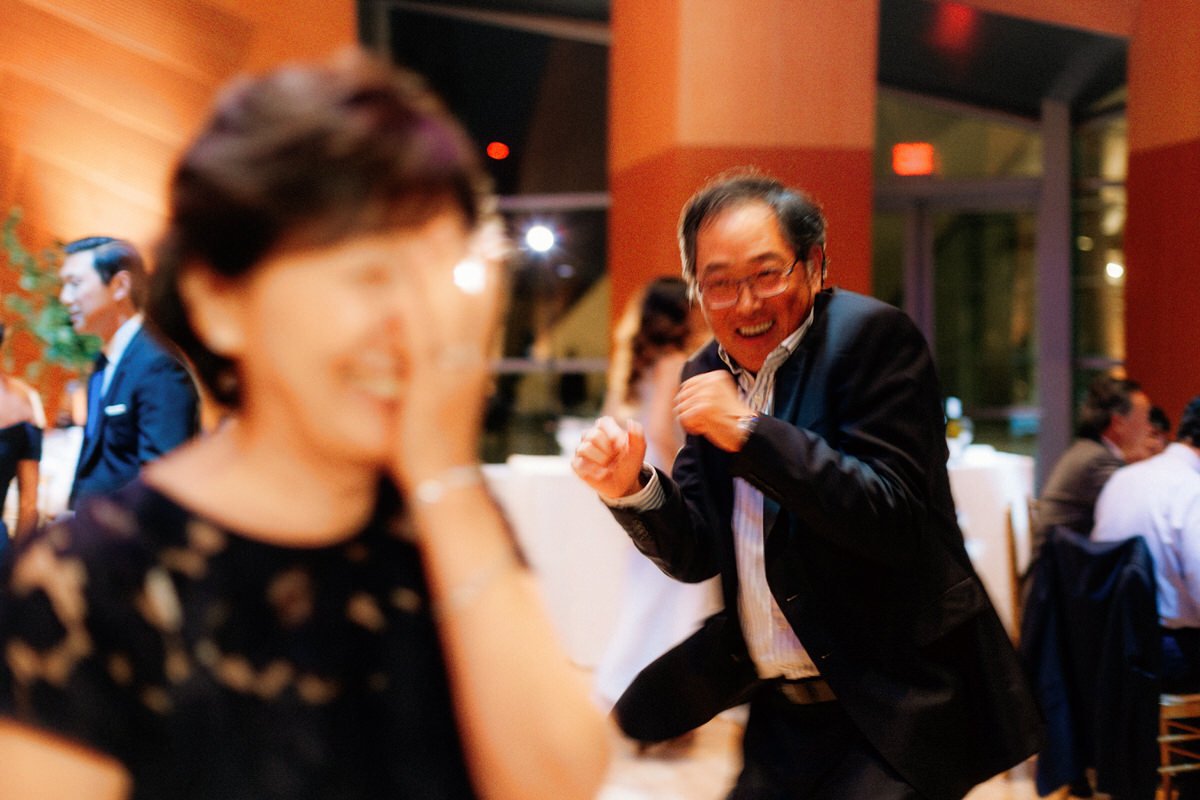 wife is playfully embarrassed by her husband on the dance floor
