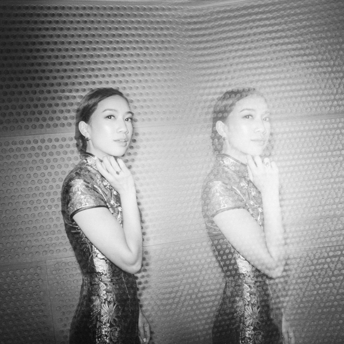 double exposure photo of bride wearing a traditional Cheong Sam dress