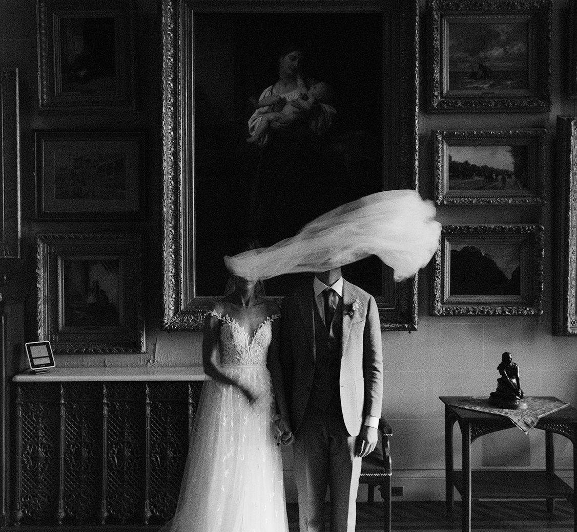 veil over a wedding couple inside a gothic revival mansion in the hudson valley