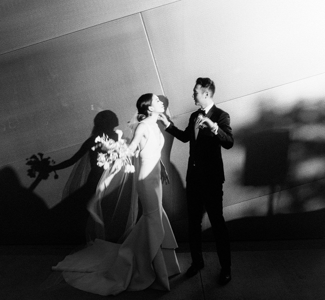 wedding couple dancing outside walt disney concert hall venue in los angeles