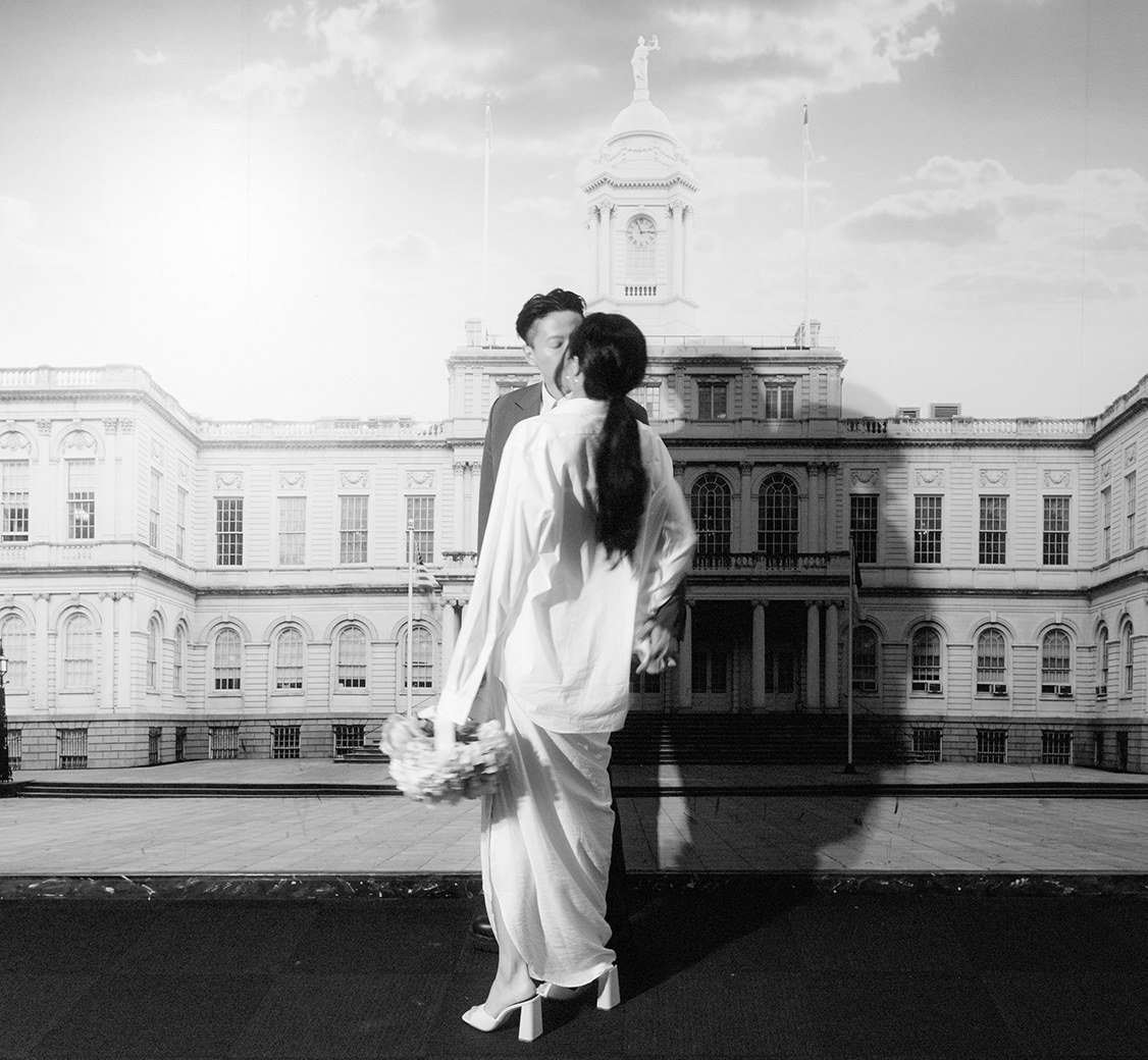 wedding couple standing in front of white house photo inside nyc city hall