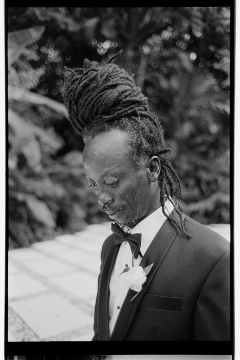35mm film photo of jamaican groom