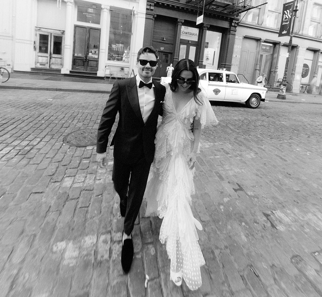 wedding couple wearing sunglasses while walking through the streets of manhattan