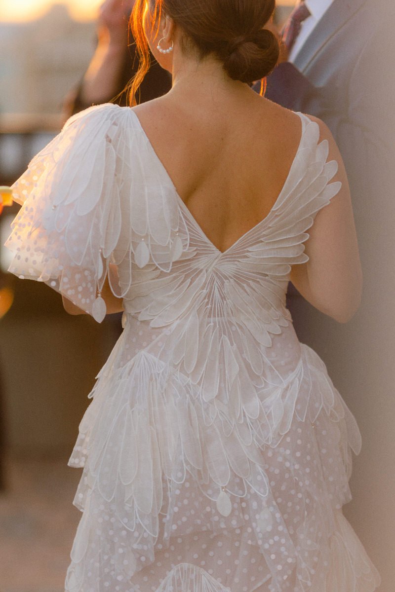 back details of a Zimmerman dress with feathers and polka dots during golden hour in NYC