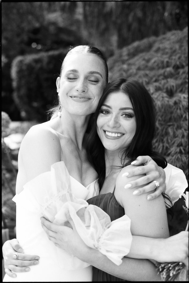 35mm film photo of bride smiling with wedding guest in Vancouver
