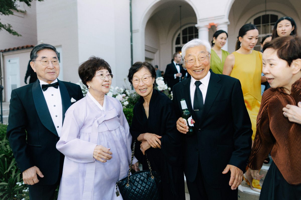 older Korean wedding guests during cocktail hour at Ebell of LA
