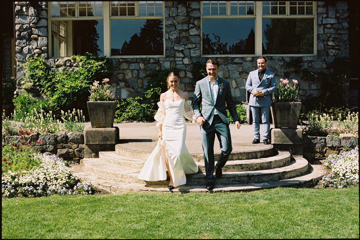35mm film photo of bride and groom after getting married at Stanley Park Pavilion