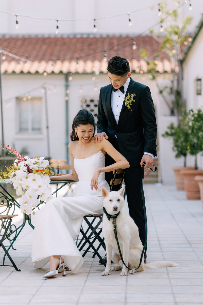 wedding couple with their Jindo dog inside the Ebell of LA courtyard