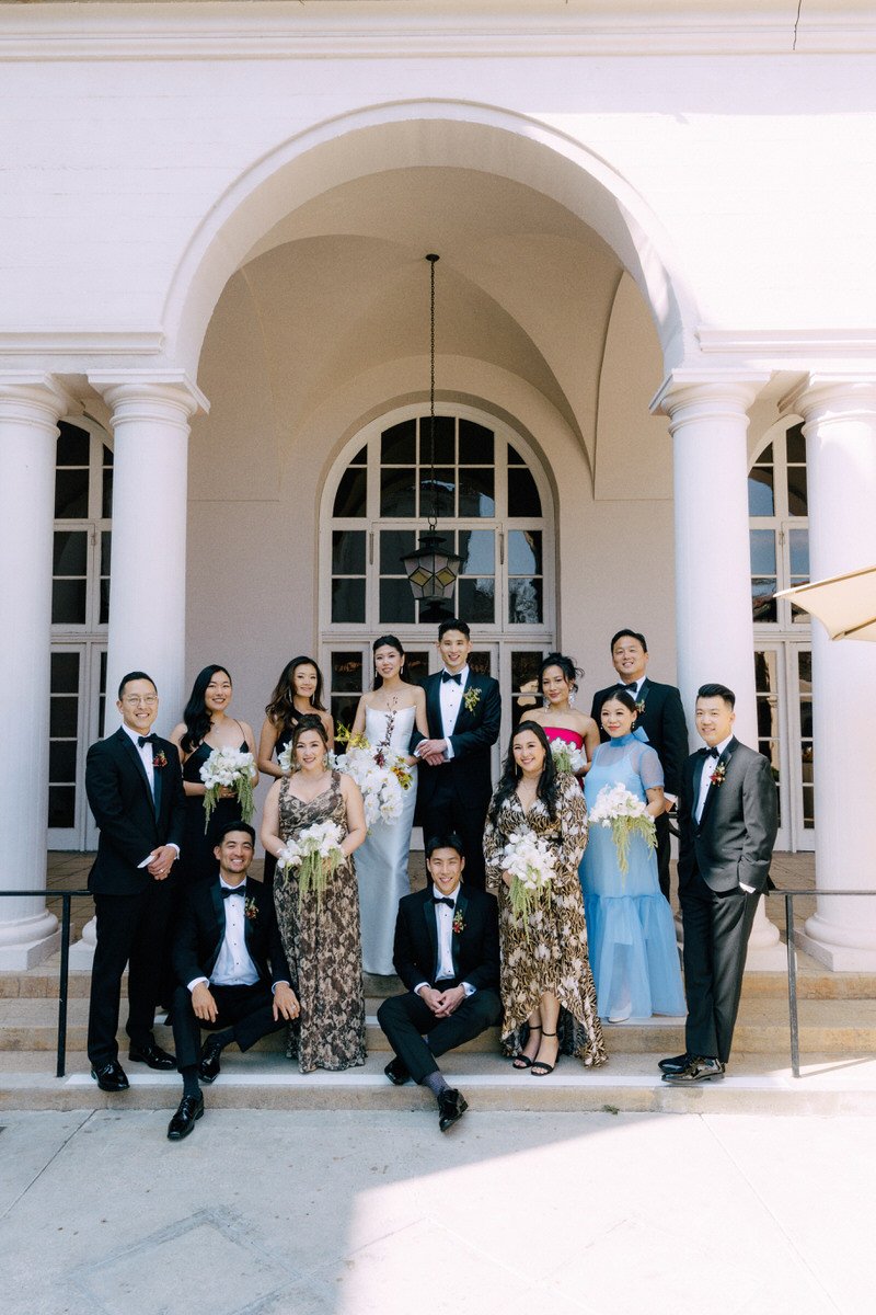 beautiful wedding party posing in an archway at the Ebell of LA