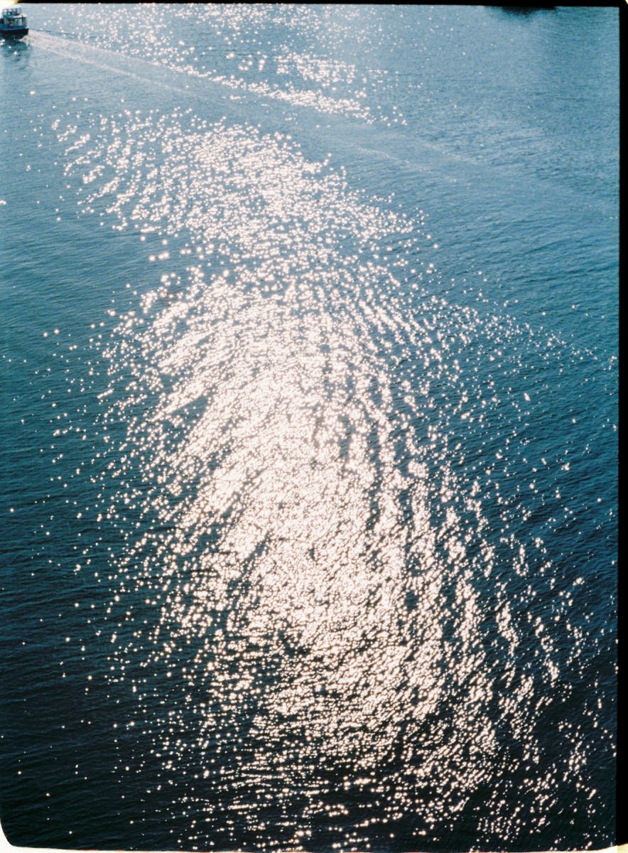 35mm photo of sun sparkling off water in Vancouver