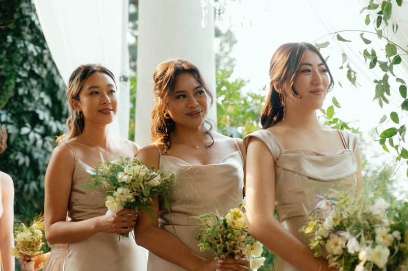 bridesmaids smiling during wedding ceremony at hycroft manor