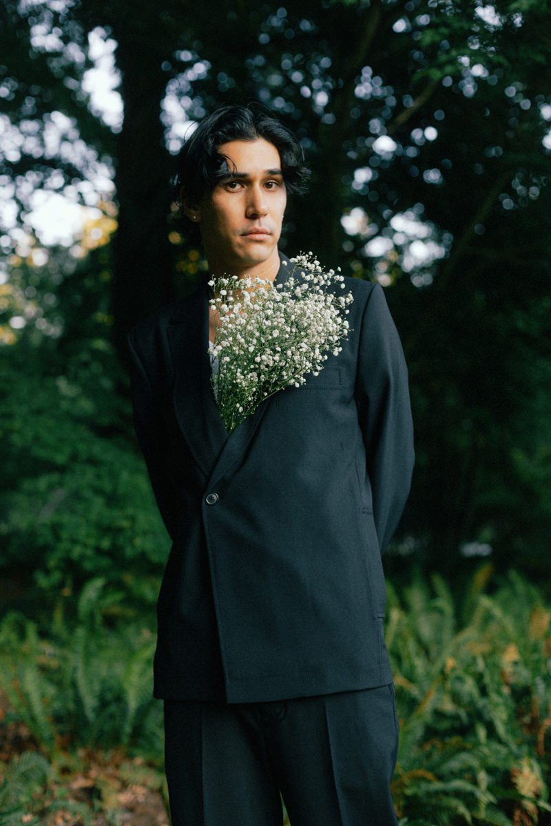 babys breath bouquet tucked inside grooms blazer