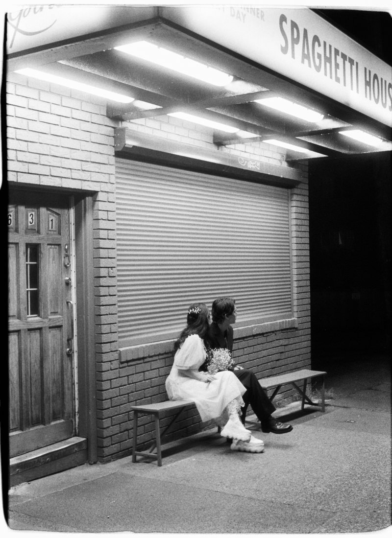 engaged couple photographed on 35mm film at night in vancouver