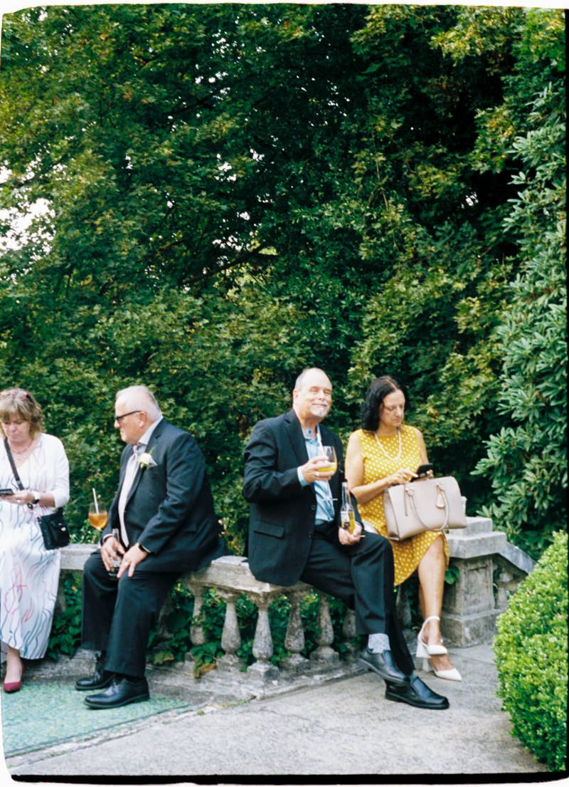 35mm photo of wedding guests during cocktail hour