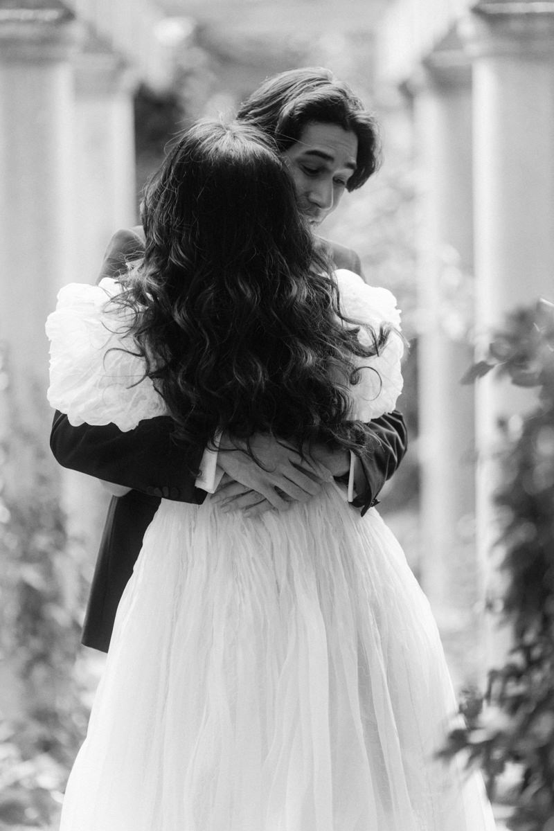 emotional groom embracing his bride to be