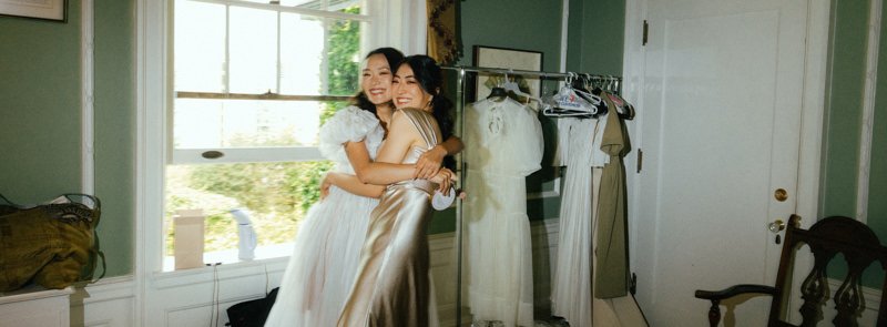 bride hugging a bridesmaid