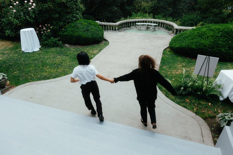 wedding guests running off while holding hands