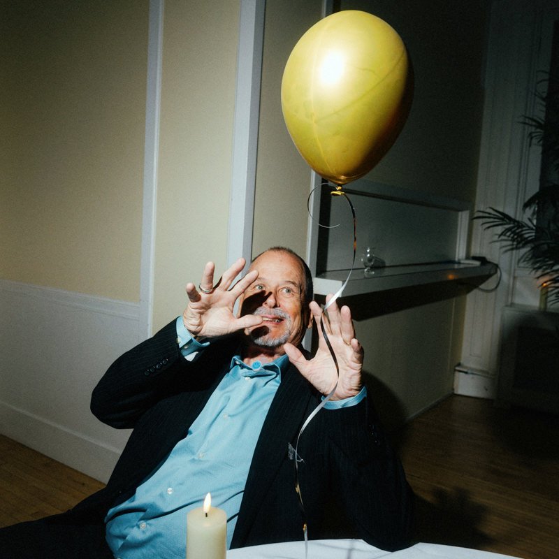 wedding guest with yellow balloon