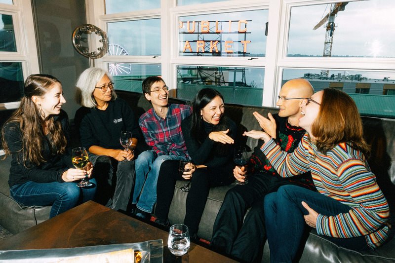 wedding guests enjoying each others company in a space overlooking Seattle Public Market