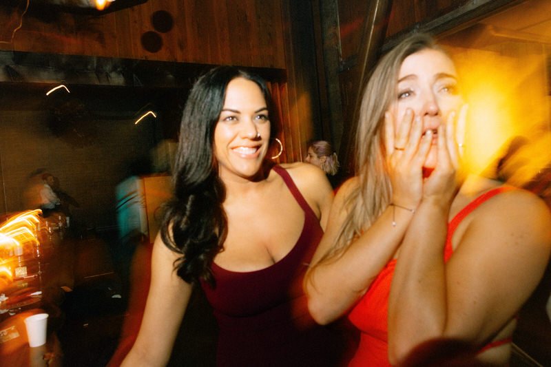 wedding guests enjoying themselves on the dance floor