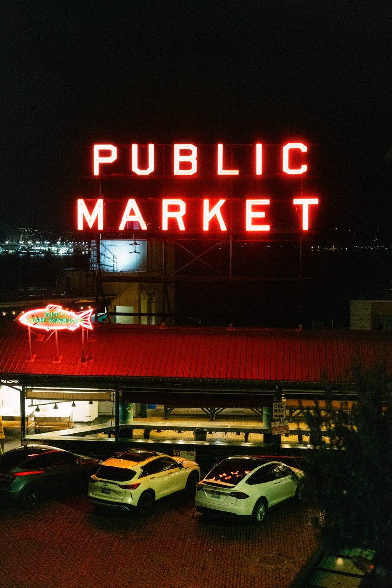 35mm film photo of illuminated Seattle Public Market at night time